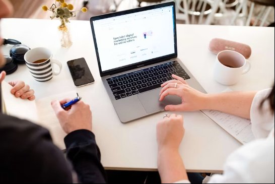 Digital Marketing experts working on their laptops while drinking coffee